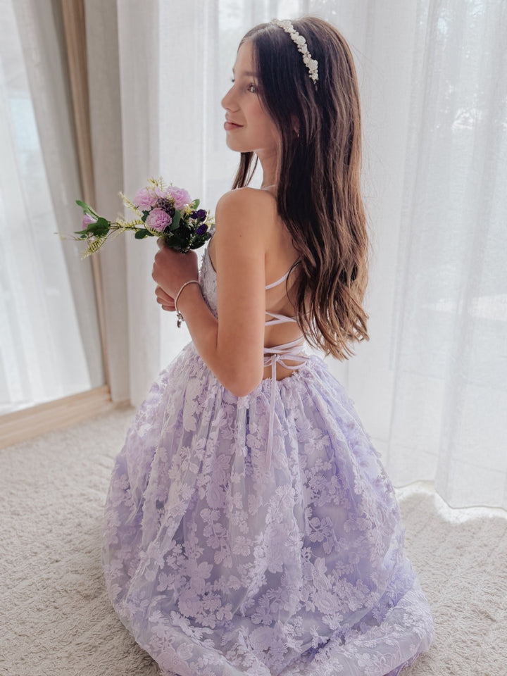 Clarissa lilac flower girl dress, back view with bouquet.