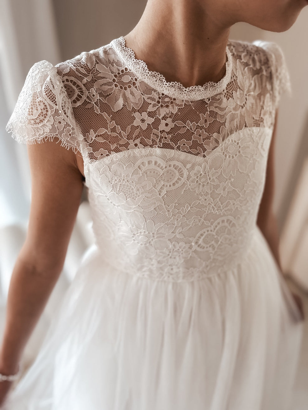 Close-up of lace bodice on Abby Grace White Lace Dress – delicate floral lace detail