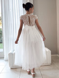 Lifestyle photo – Abby Grace White Lace Dress at wedding celebration for girls