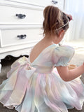 Side angle of Anastasia Girls Dress showing soft rainbow shimmer in the light