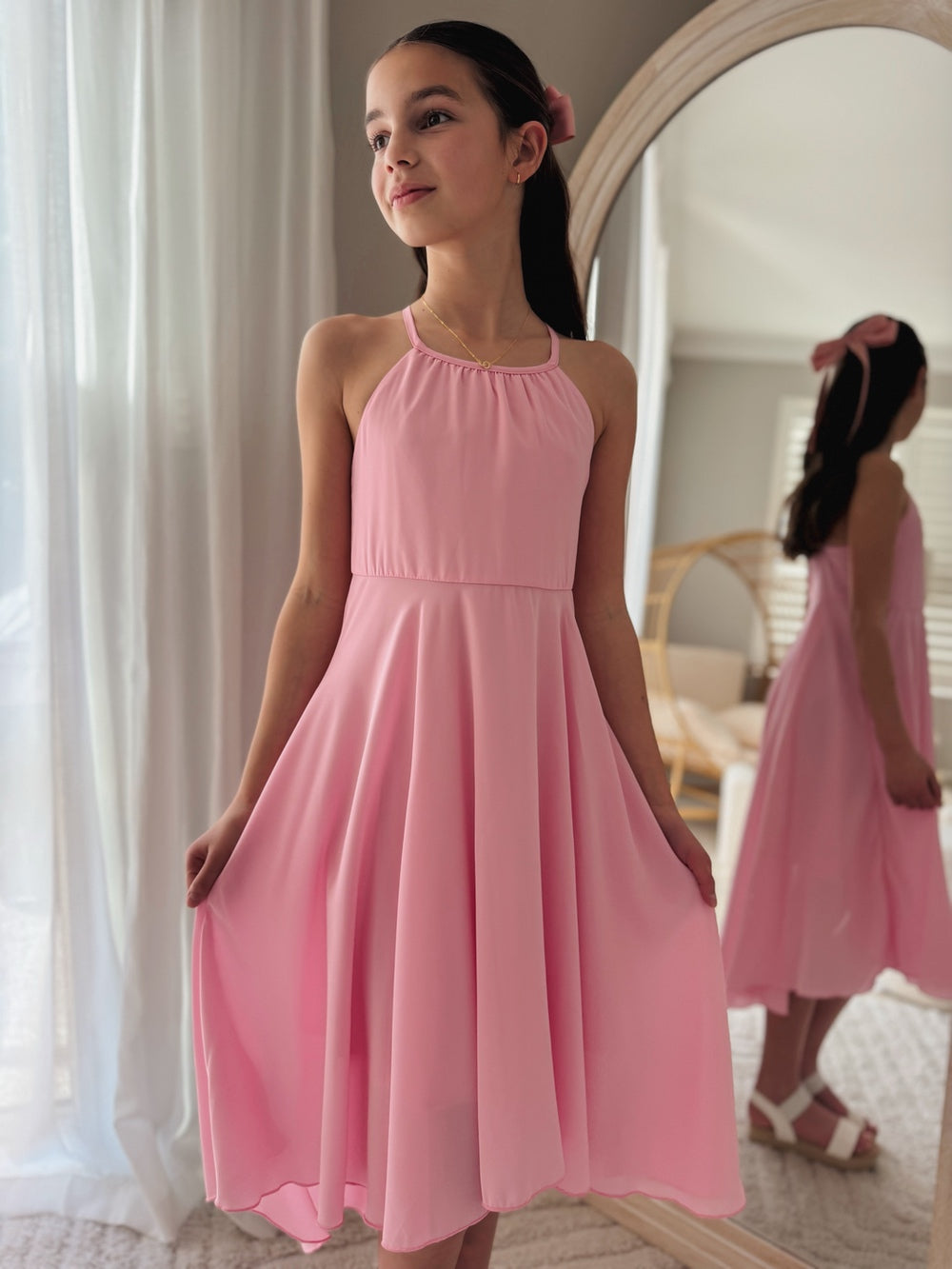Girls’ party dress in pink with a relaxed fit and tiered style