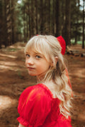 little girls tulle xmas dress with puff sleeves and red bow