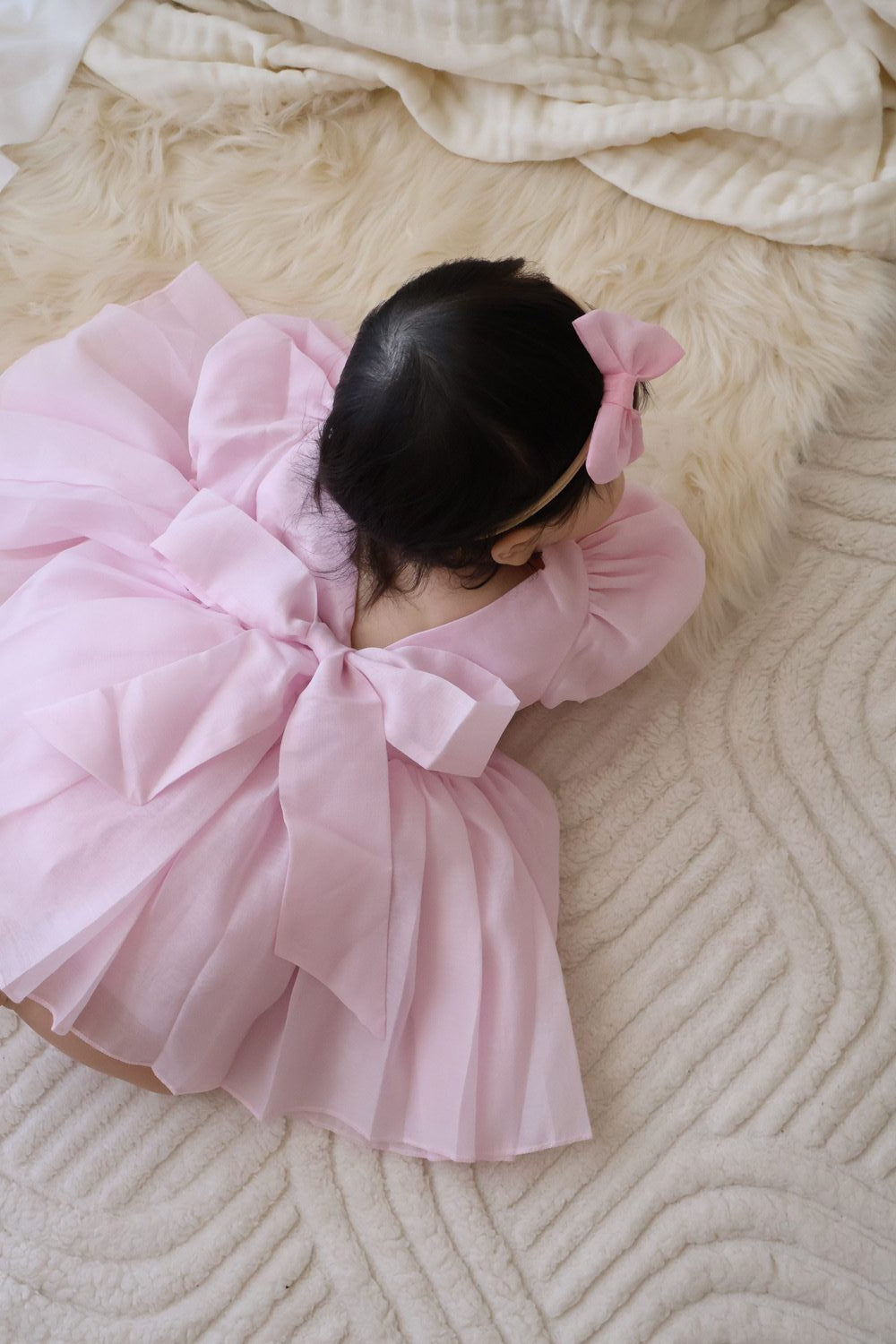 Baby girls pink birthday dress with bow