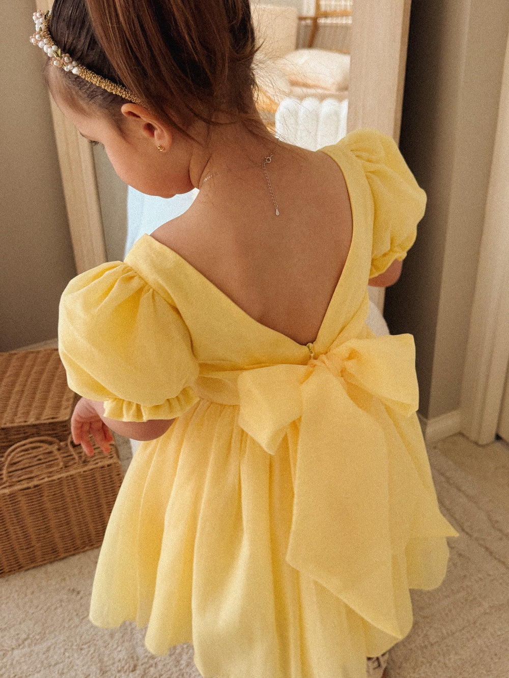 Arabella Yellow Girls Baby Dress - Baby DressesBack view of Arabella baby romper showing V-back and large bow