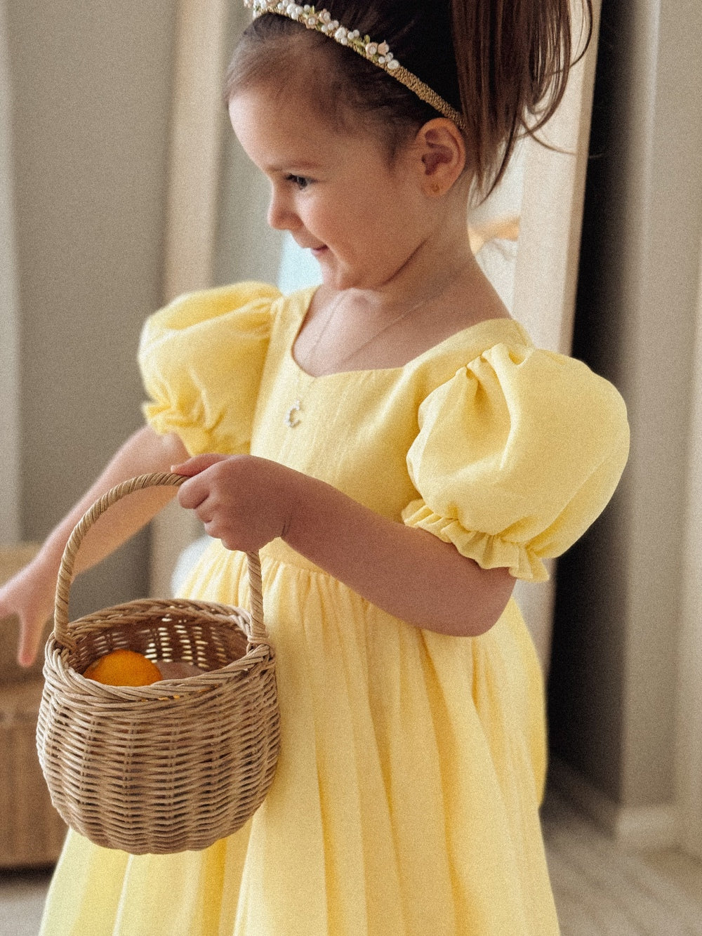 Elegant yellow puff sleeve dress with shimmer fabric and large back bow