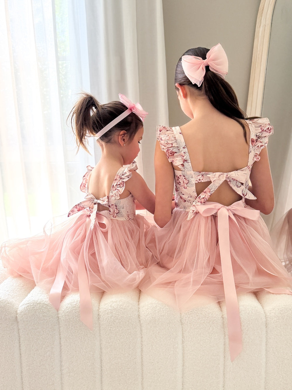 Girls posing in Audrey Rose Nectar Dress with matching hair bows