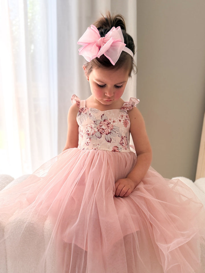 Girl wearing Audrey Rose Nectar Pink Dress with floral bodice and dusty pink tulle skirt
