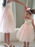 Matching sister photo in Audrey Rose pink dresses for birthday celebration