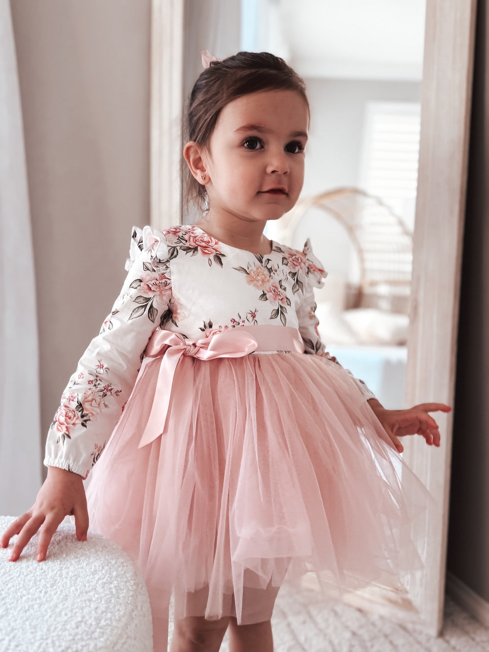 Front view of girls dusty pink floral long sleeve dress for special occasions