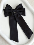 Statement black satin bow with long tails