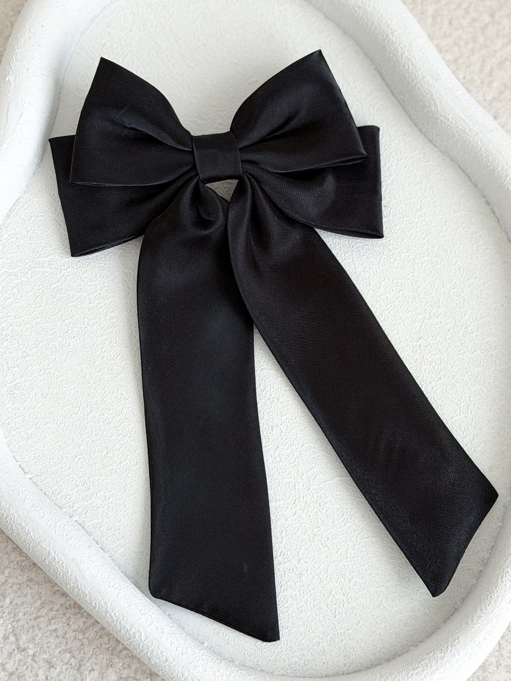 Statement black satin bow with long tails