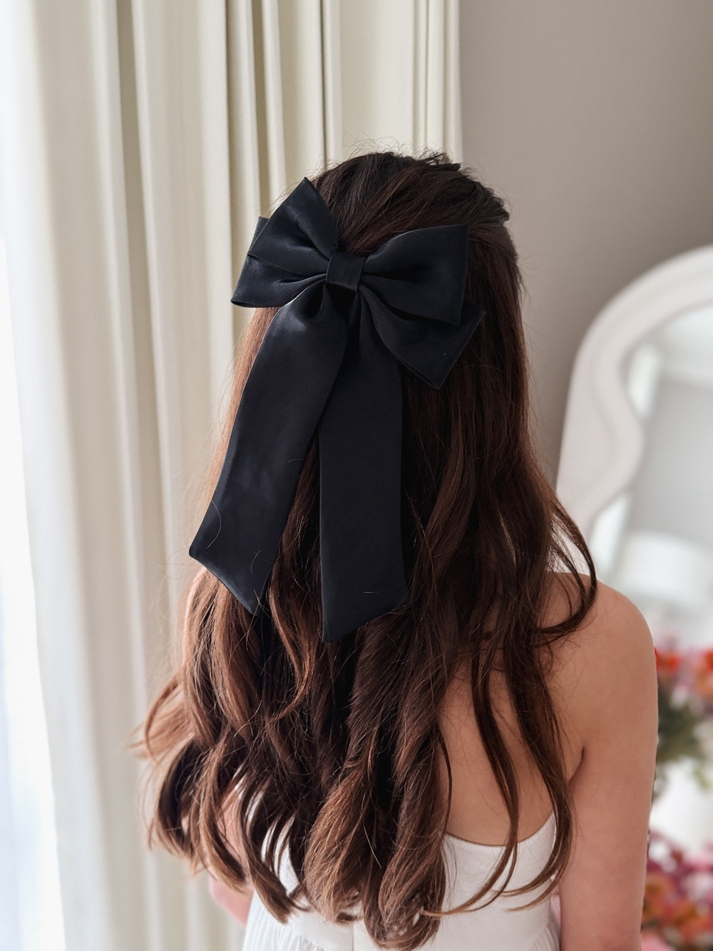 Girls black satin hair bow with long flowing tails