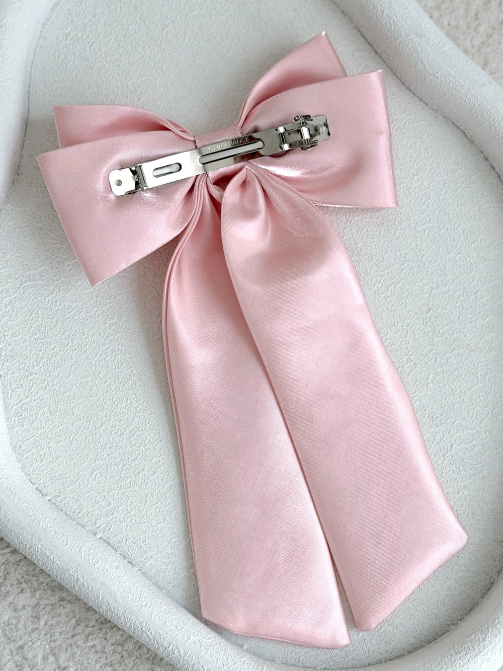 Classic pink satin bow clip for polished girls hairstyles