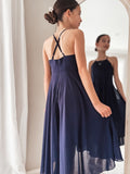 Navy blue girls dress with open back and flowing hemline