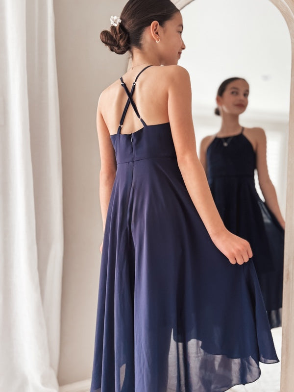 Navy blue girls dress with open back and flowing hemline