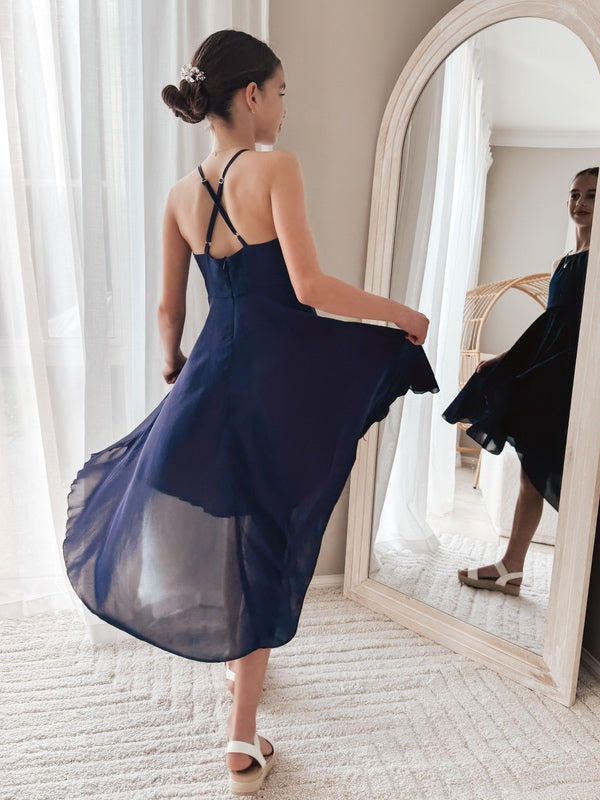Soft chiffon graduation dress in navy from back angle