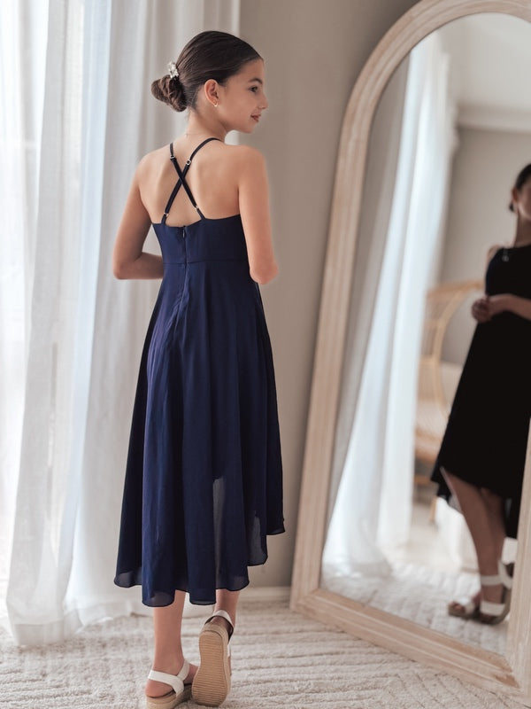 Graduation day dress in navy captured mid-motion