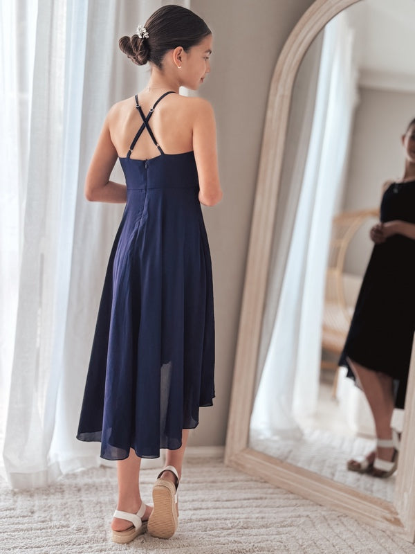 Soft chiffon navy dress styled for calm graduation photo