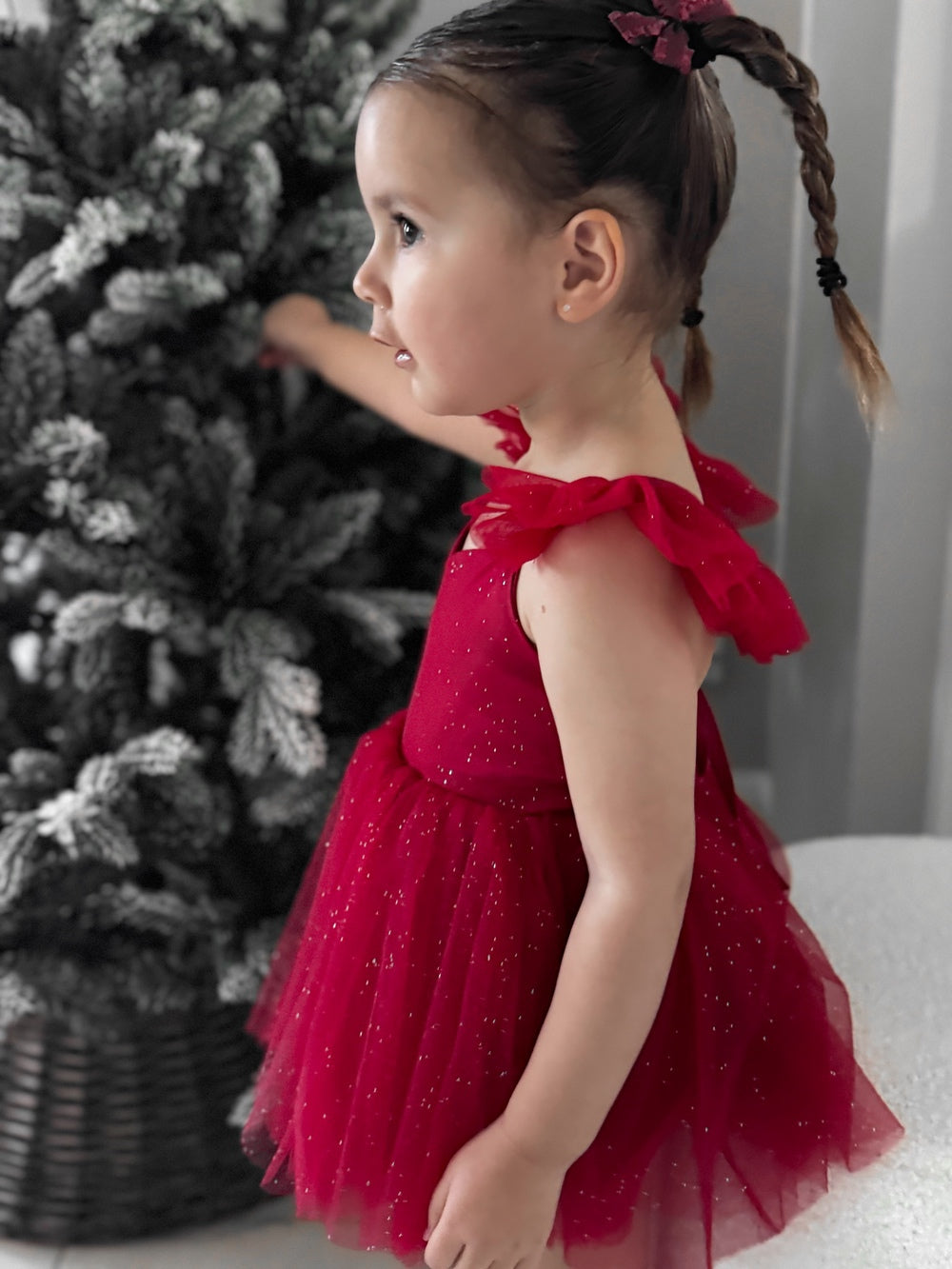 Sparkly holiday romper with flutter sleeves in soft movement