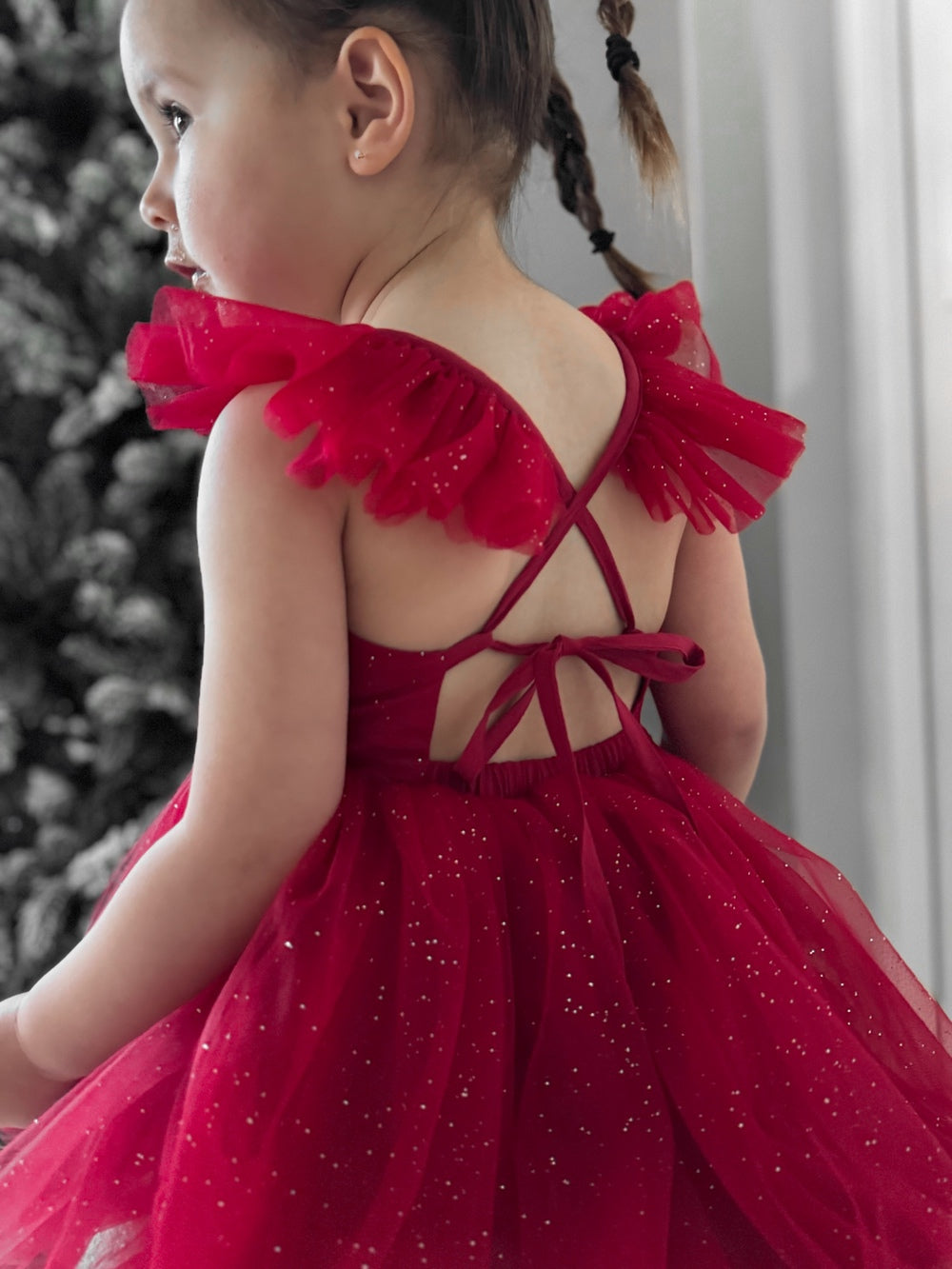 Baby romper with tie-up back and red sparkle tulle skirt