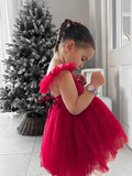 Side profile of red sparkle Christmas dress with flutter sleeves