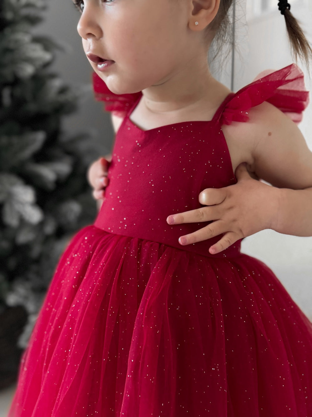 Girls’ festive red party dress styled for Christmas celebrations.