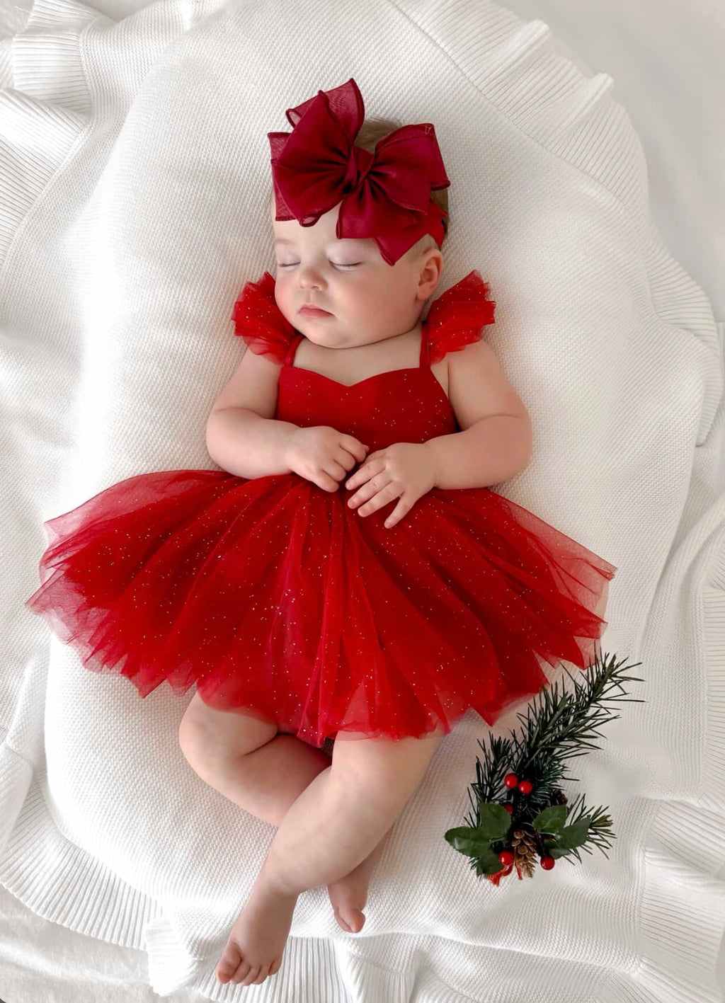 Belle Red Sparkle Baby RomperShimmery red Christmas girls baby romper with puff skirt effect and sparkle detail - baby sleeping 