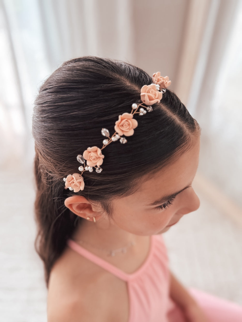 Close-up of Blush Meadow Girls Headpiece showing pink porcelain flowers and pearl detailing