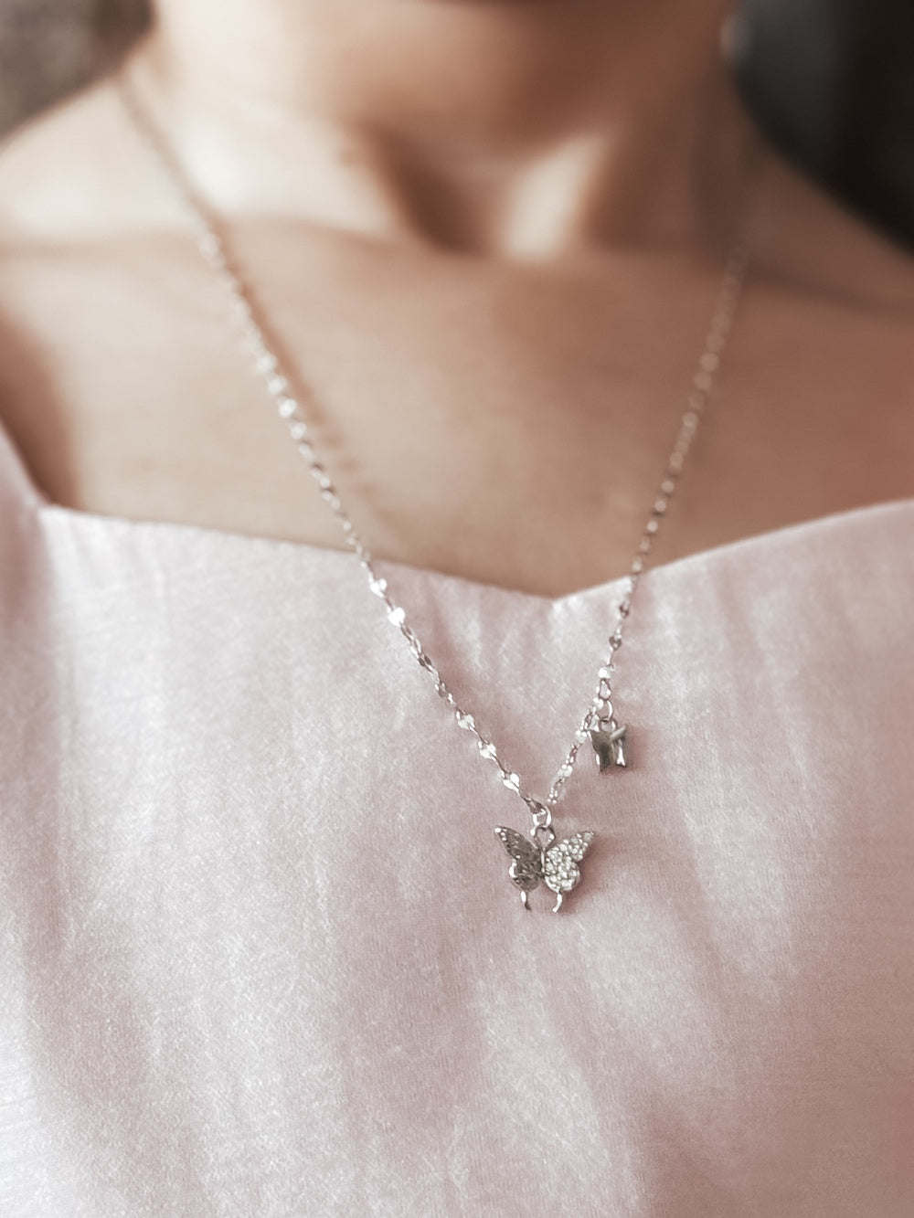 Butterfly Whispers Girls Silver Necklace - All ProductsGirl wearing silver butterfly necklace with dress