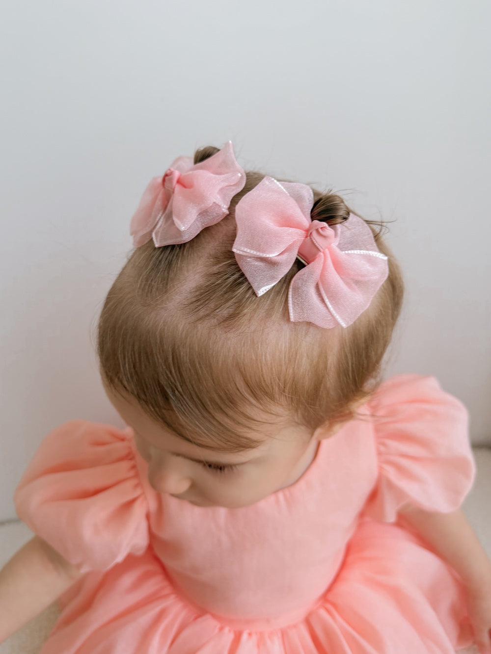 Blush peach pigtail bows for baby and toddler hair