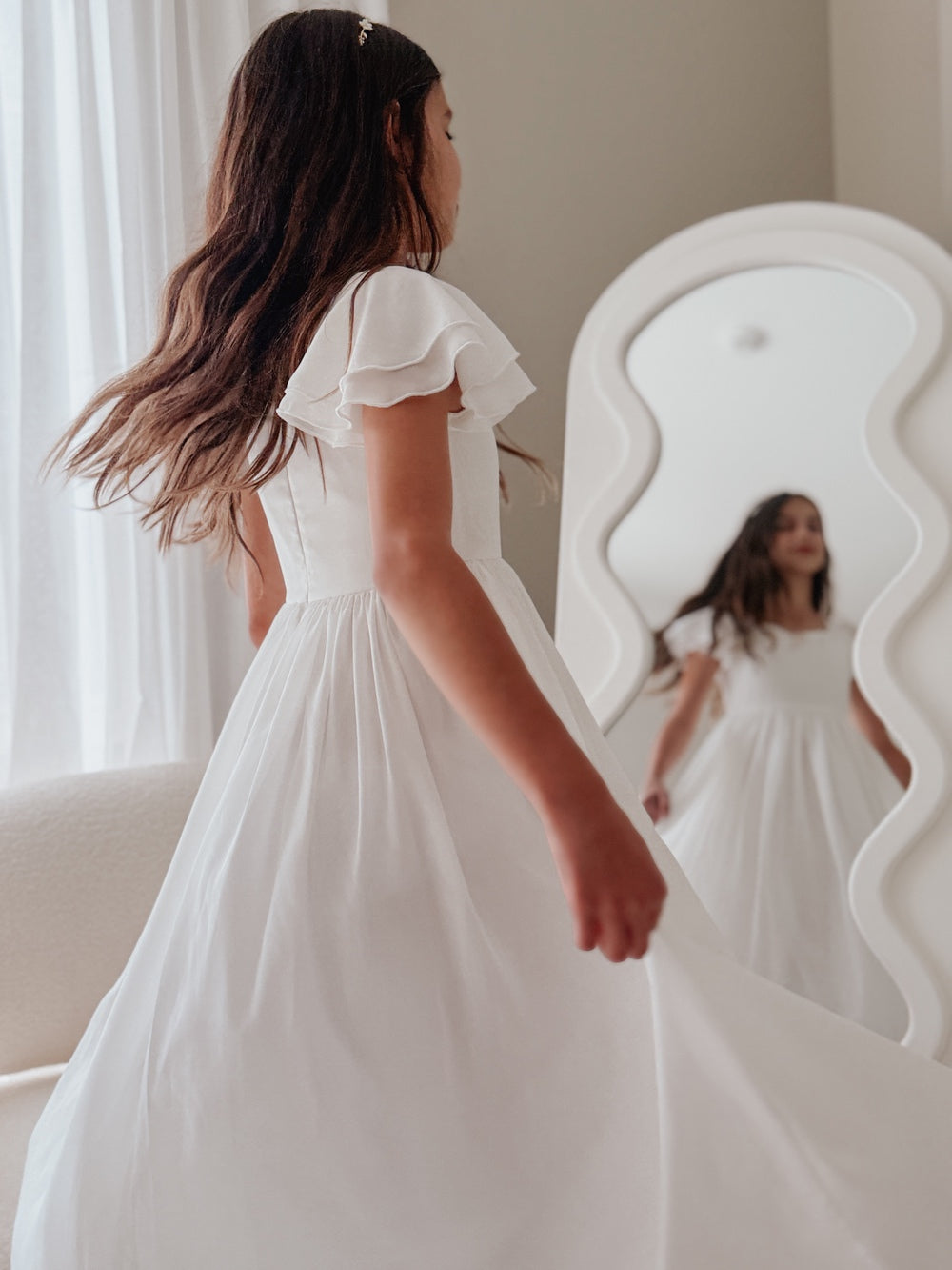 girls white Communion dress with frill sleeves