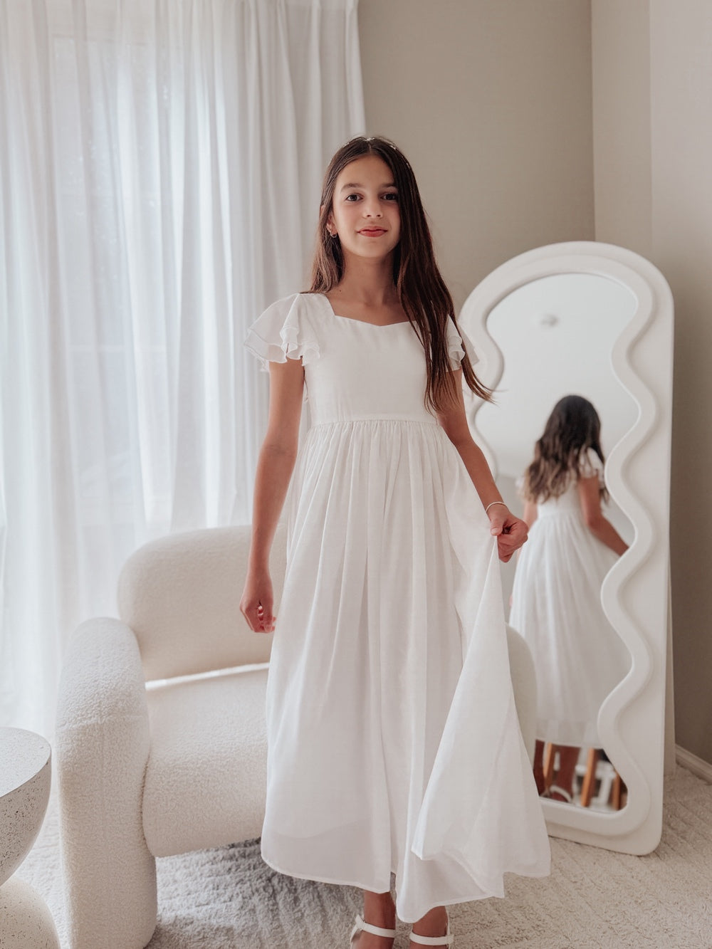 girls white occasion dress with soft flowing skirt