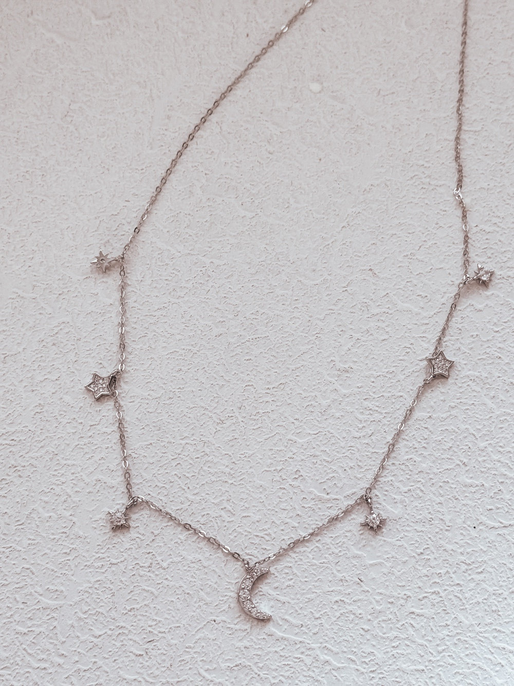 Starry silver necklace for girls with celestial charm details