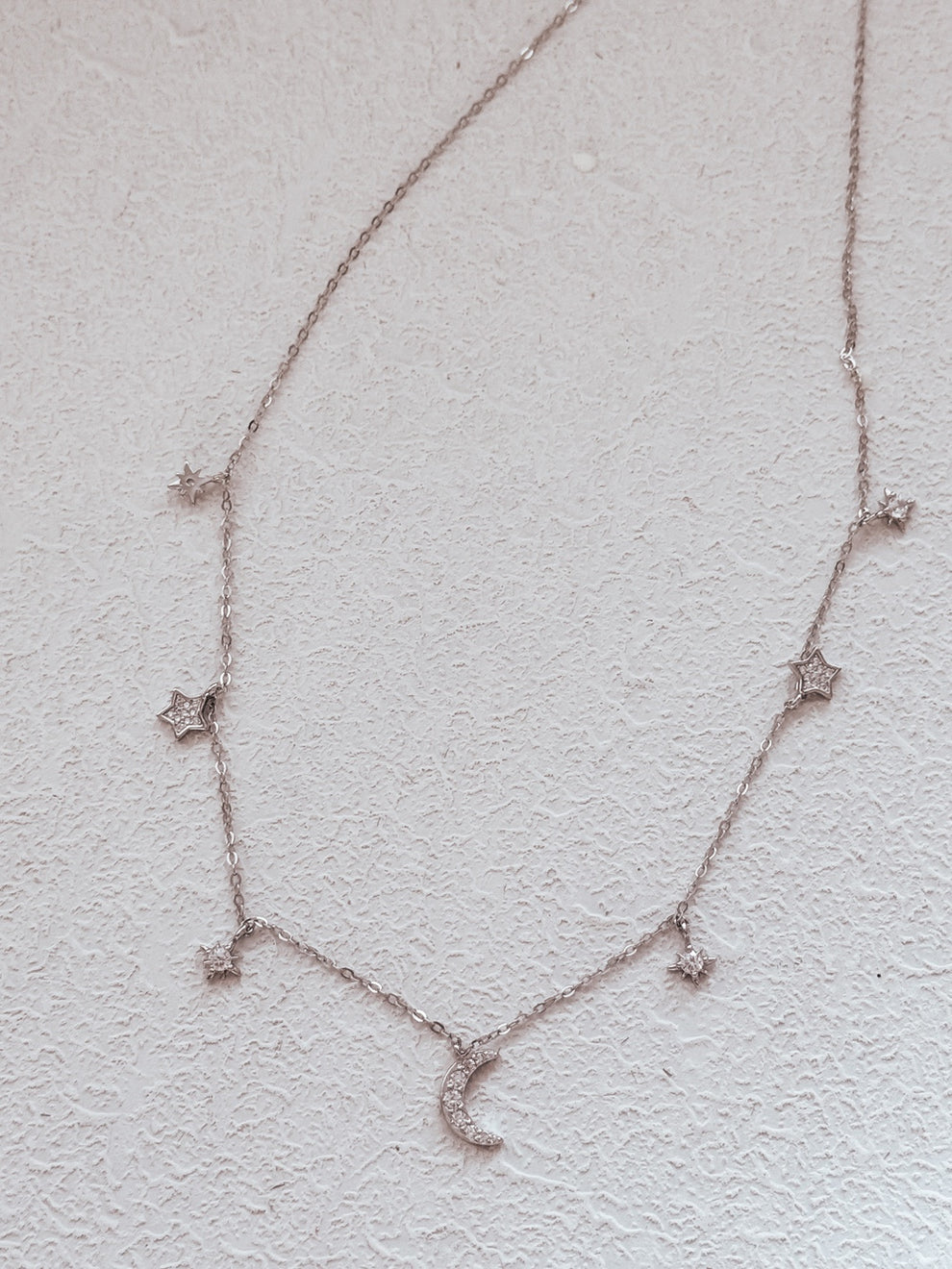 Starry silver necklace for girls with celestial charm details