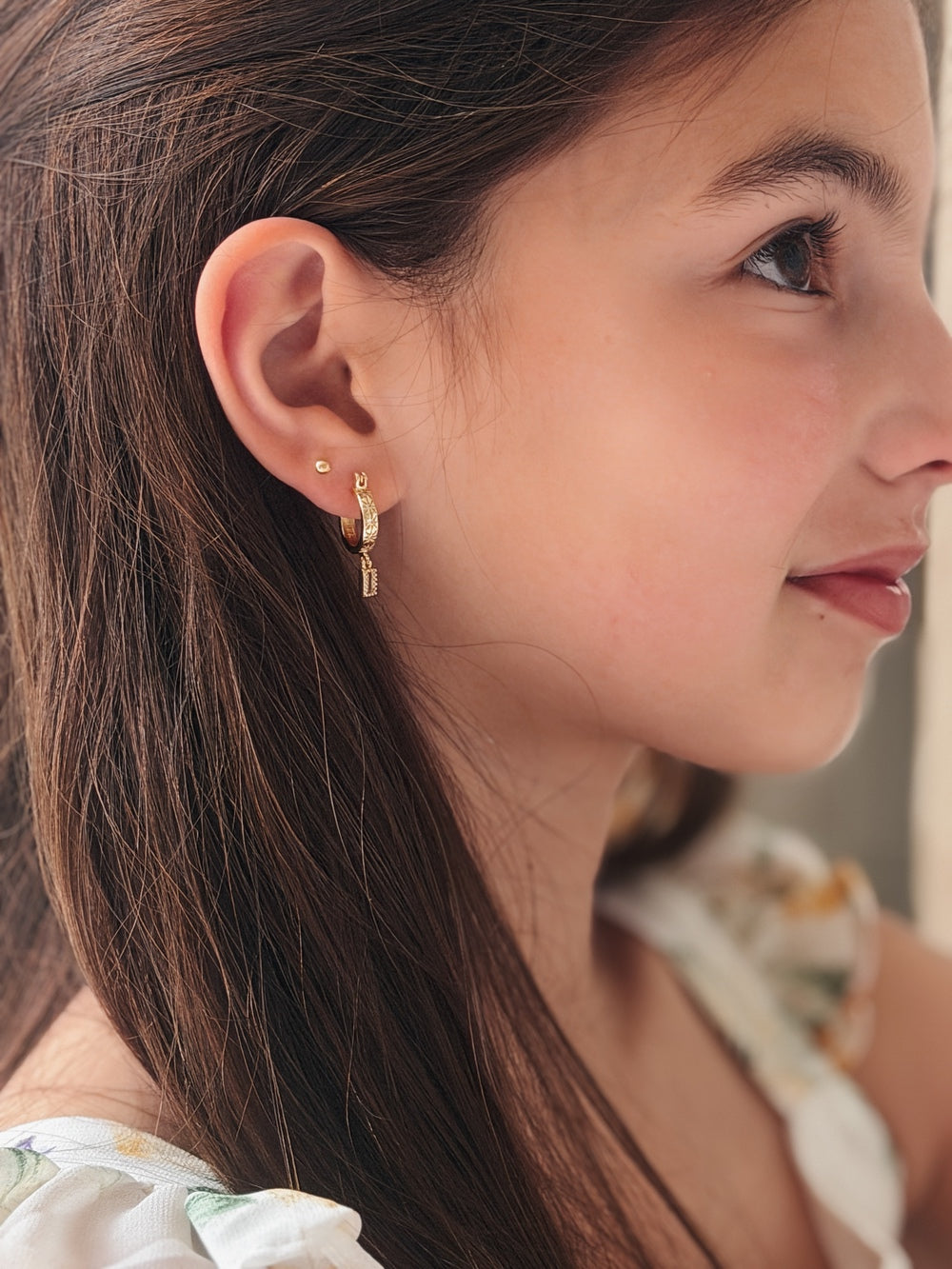 Model wearing Celestial Girls Gold Hoop Earrings – elegant accessory for girls