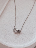 Silver girls graduation necklace with heart and circle charm