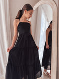 Soft chiffon black dress with modern neckline and full skirt