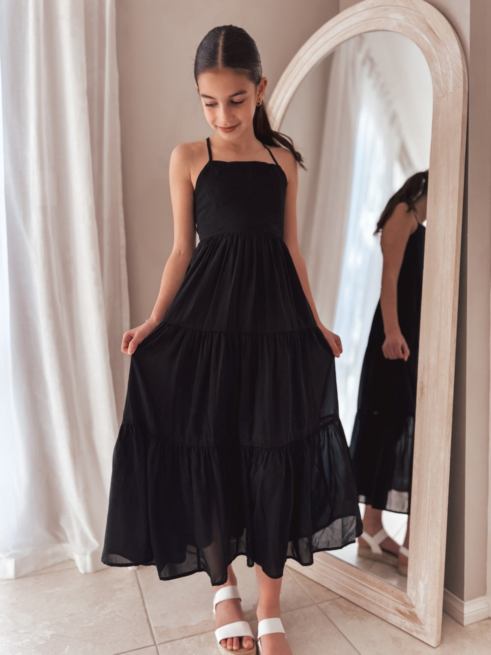 Black girls' maxi dress styled for events and formal gatherings