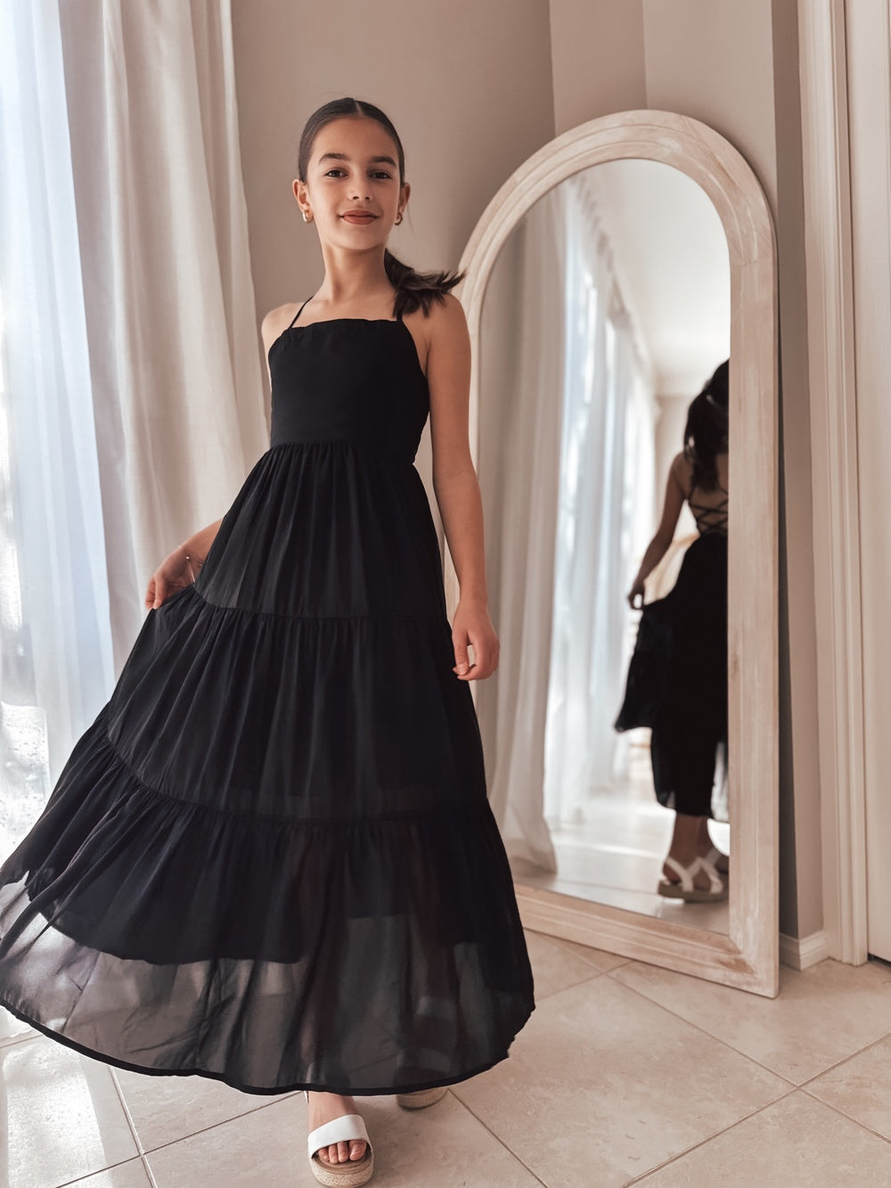 Flowing layers of black dress styled for twirls and dancing