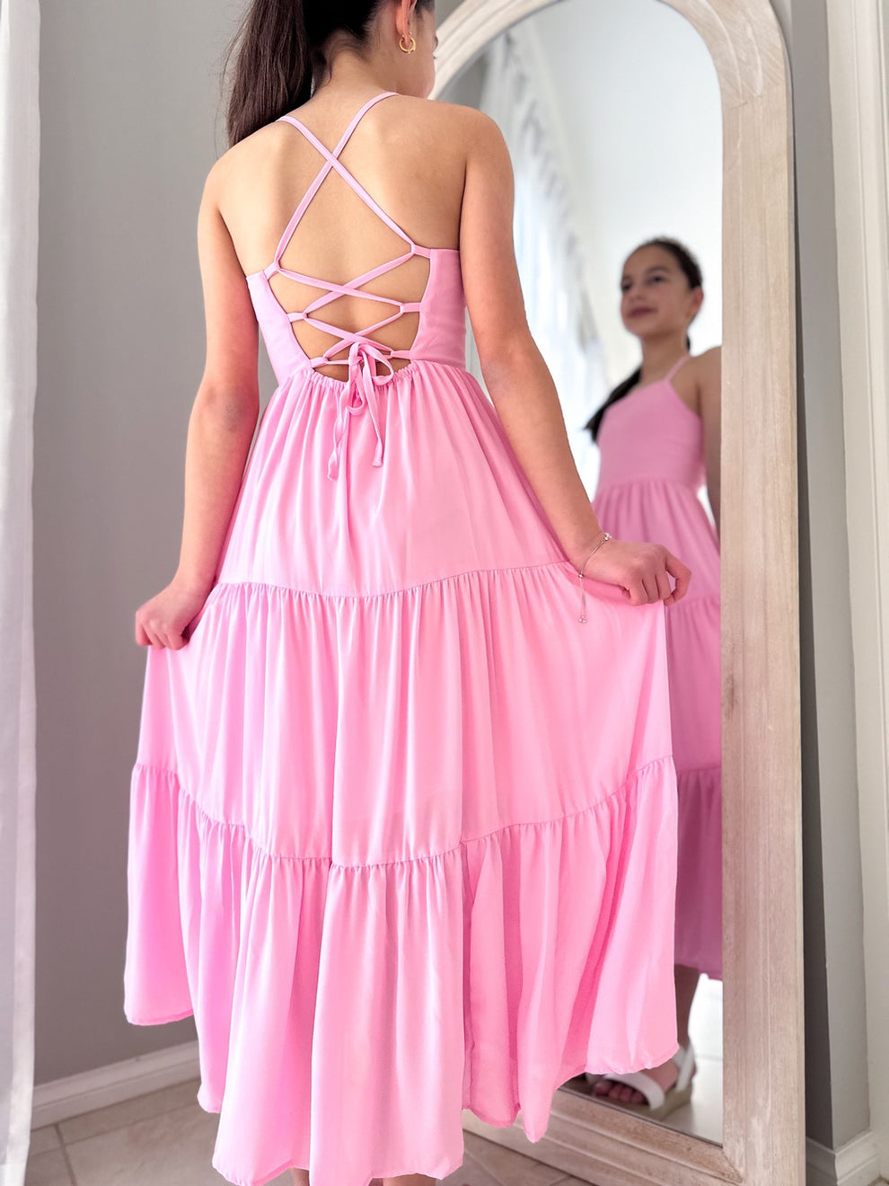 Tween party dress in pink with comfortable tie-back and maxi tiers