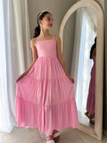 Tween girl wearing Clara pink maxi dress with square neckline and soft tiered skirt