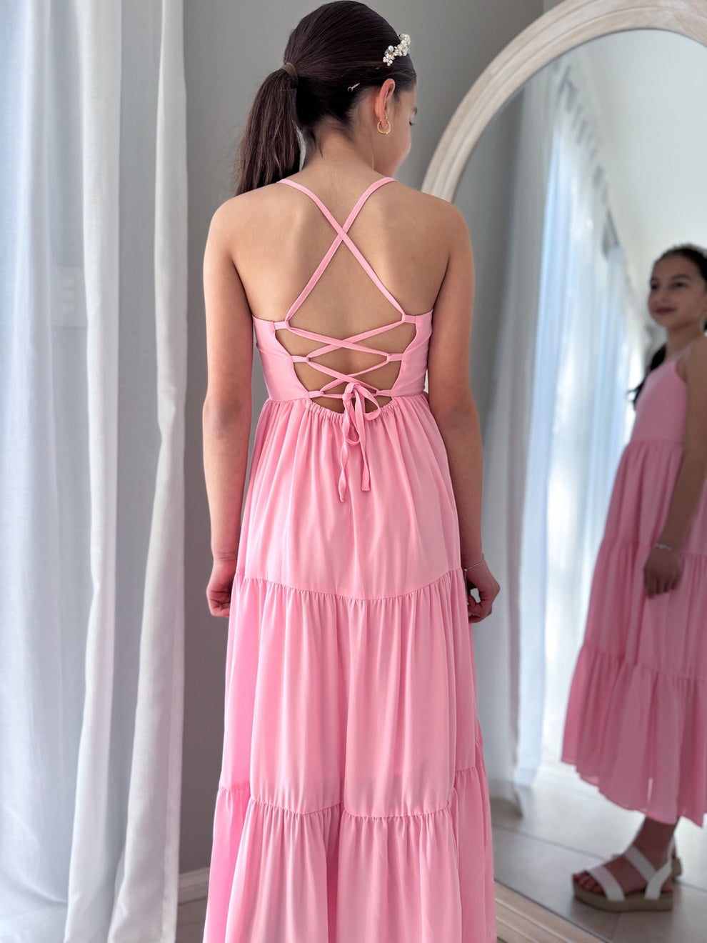 Elastic waist and tie-back featured on Clara pink chiffon dress