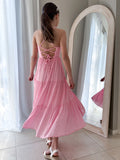 Pink dress for girls with adjustable cross tie-back and soft flowing skirt