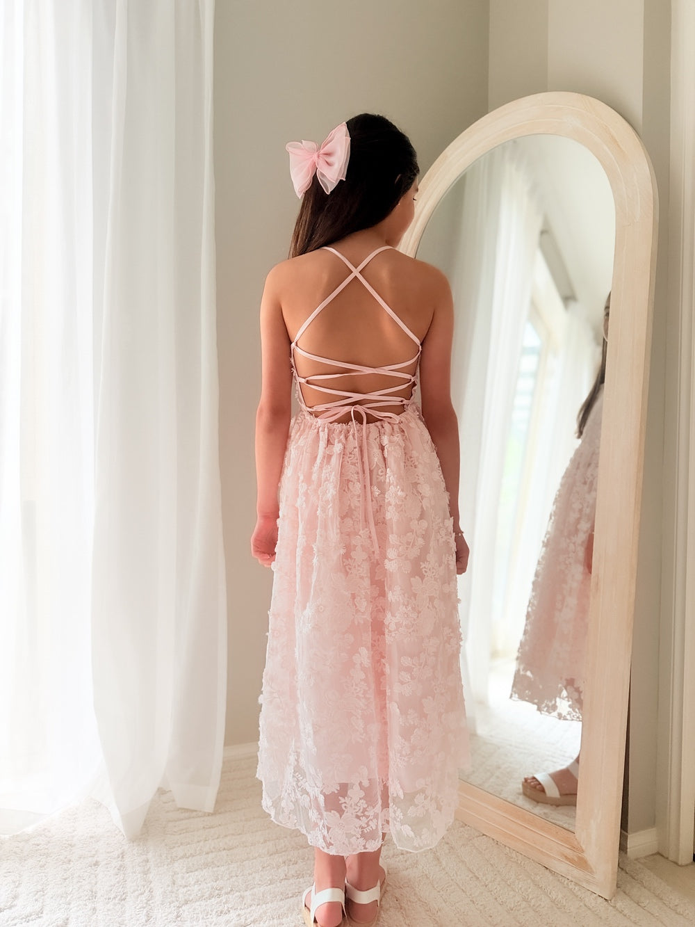 Sienna wearing Clarissa Girls Light Pink Dress – soft elegant outfit for weddings and celebrations