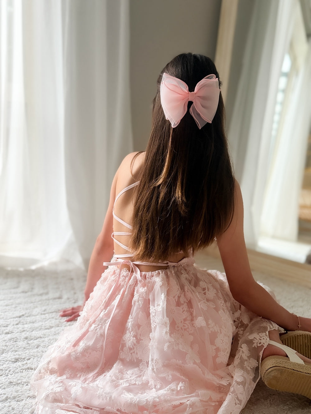 Detail shot of lace-up back and embroidery details – Clarissa Girls Light Pink Dress