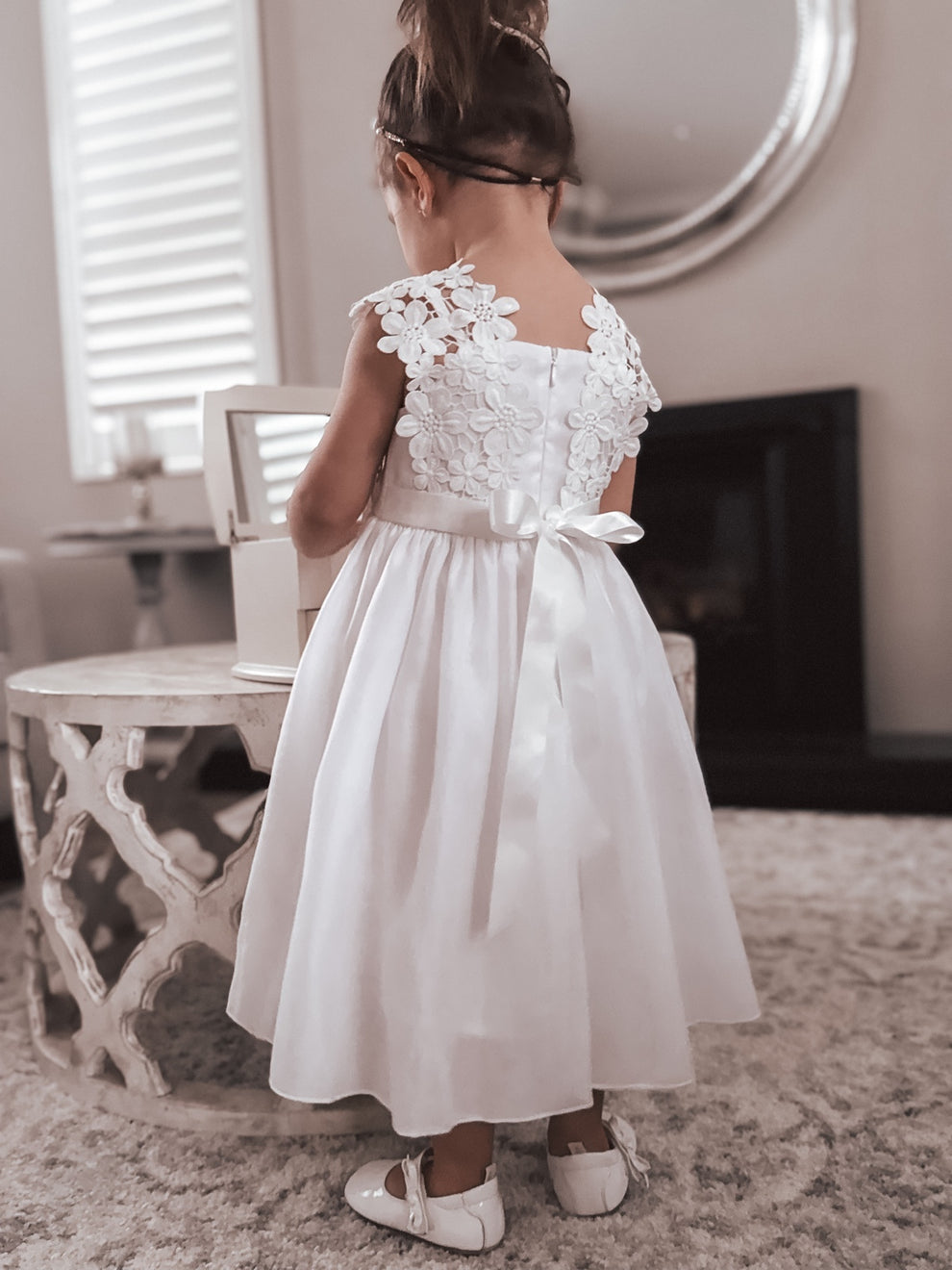 Back view of Layla dress with satin tie and zip closure