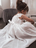 Detailed lace bodice of white flower girl dress