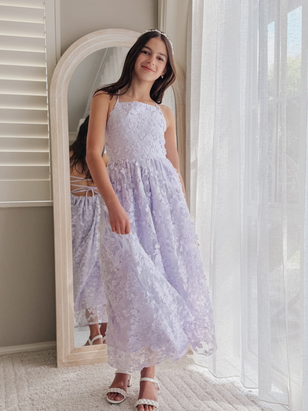 Clarissa lilac 3D flower girl dress, full-length view beside an arched mirror.