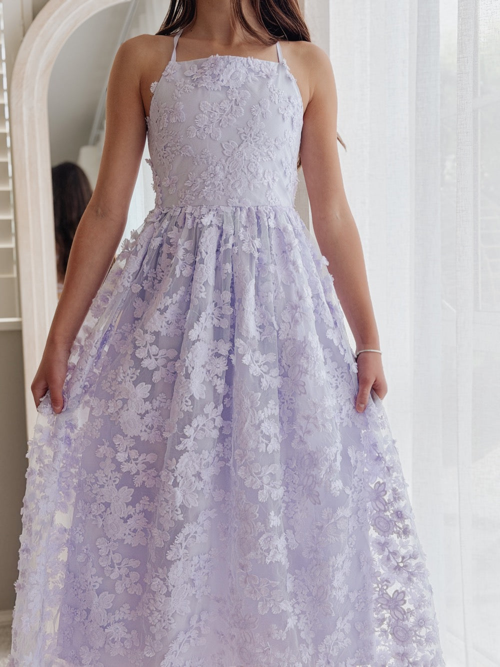 Clarissa lilac flower girl dress, front view of the fitted bodice and full 3D floral skirt.