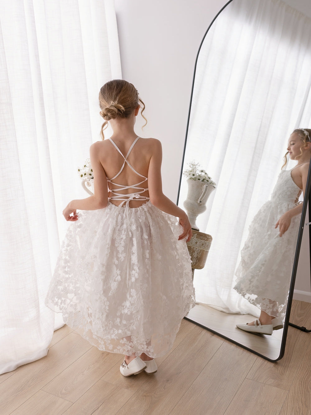 Clarissa white floral gown showing adjustable lace-up back